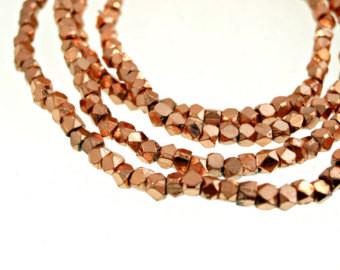 BrassNugget05 - 3.5 Faceted brass nuggets with copper plated.